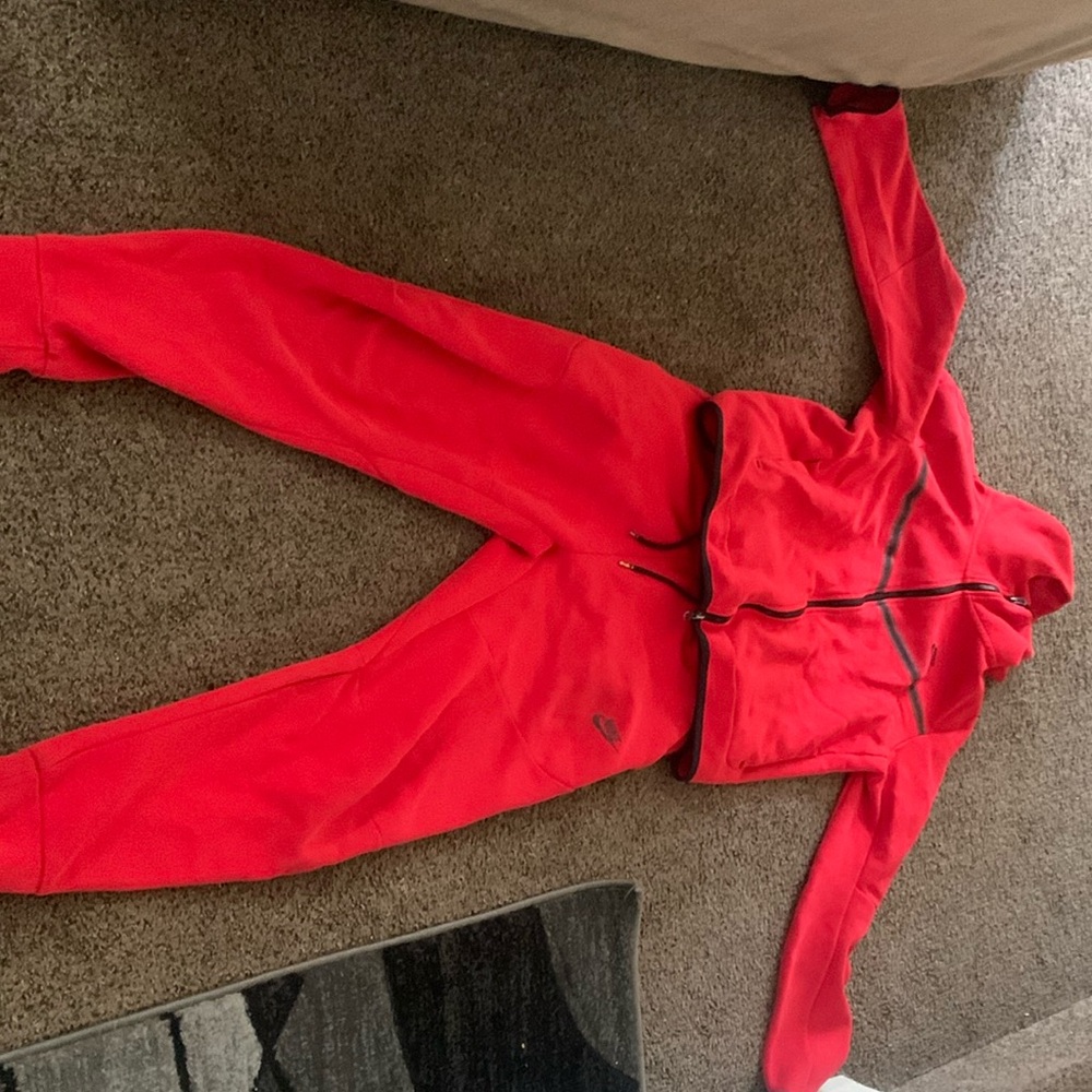 Red Nike tech jump suit